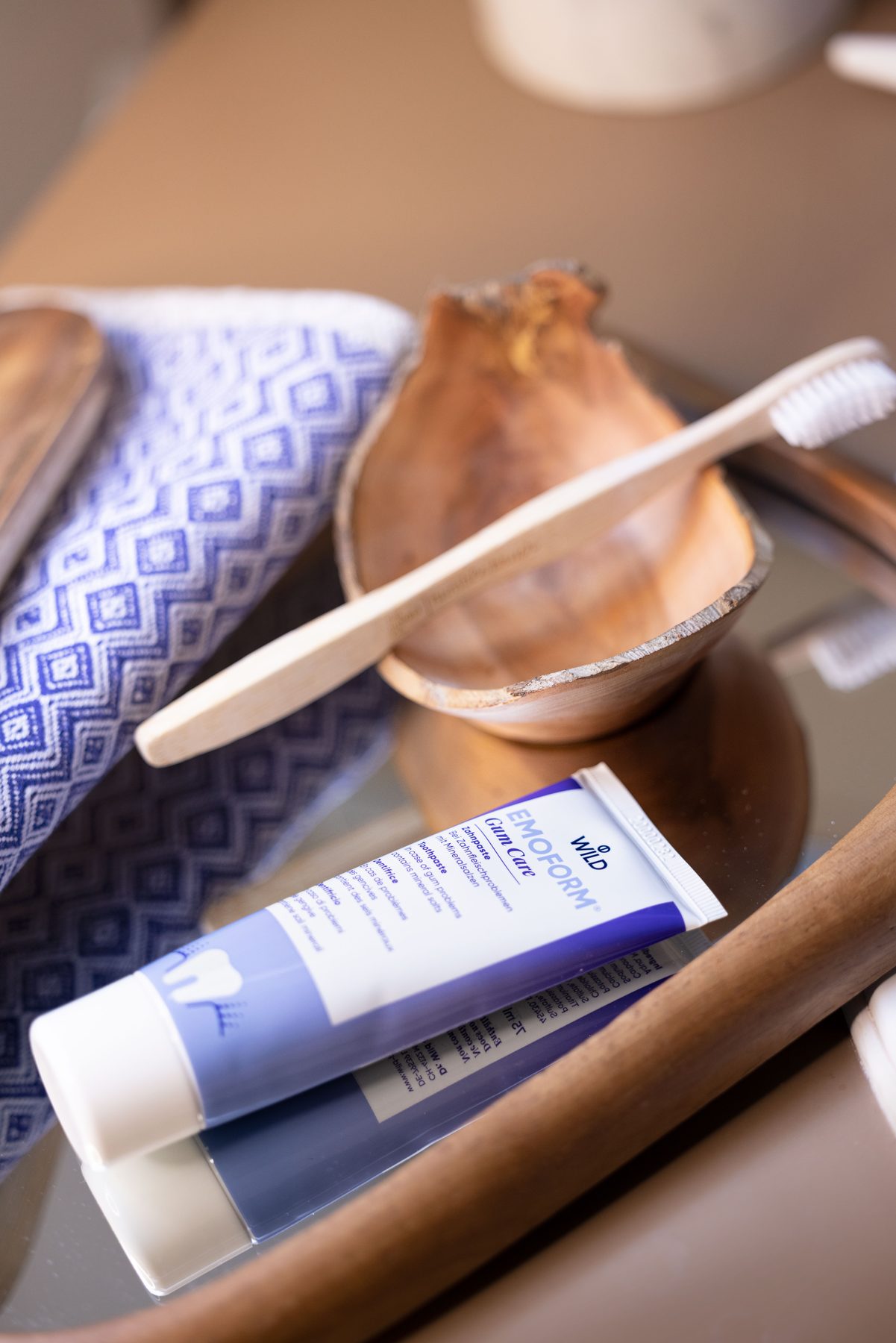 Styled flat lay: toothbrush, tube and textile
