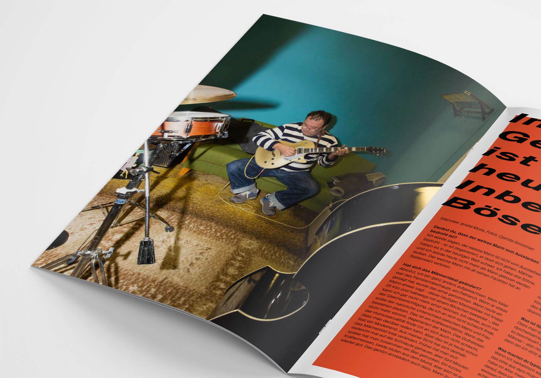 An open magazine spread: a portrait beside a bold red interview page